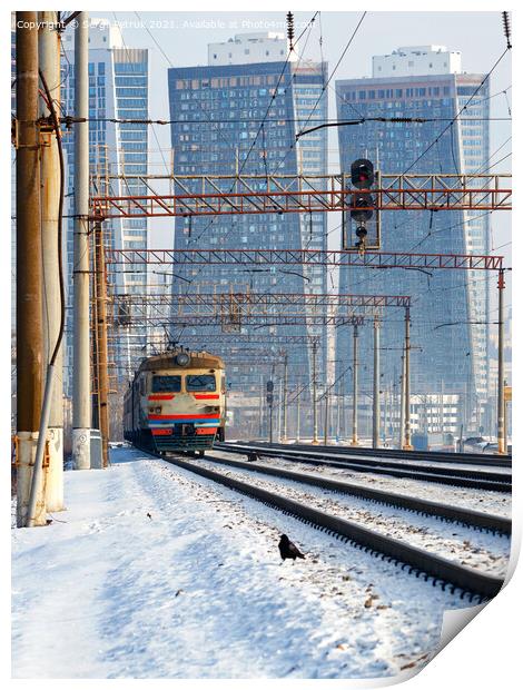 An electric train moves on rails against the backdrop of a cityscape of skyscrapers in a winter haze. Print by Sergii Petruk