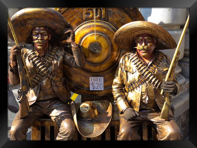 People dressed as bandidos posing at Mexico city streets Framed Print by Elijah Lovkoff
