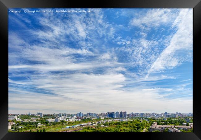 Panorama of the city under a high beautiful blue sky with light white curly clouds. Framed Print by Sergii Petruk