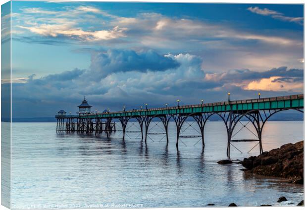 Clevedon Pier with stormy clouds Canvas Print by Rory Hailes