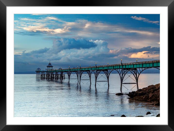 Clevedon Pier with stormy clouds Framed Mounted Print by Rory Hailes