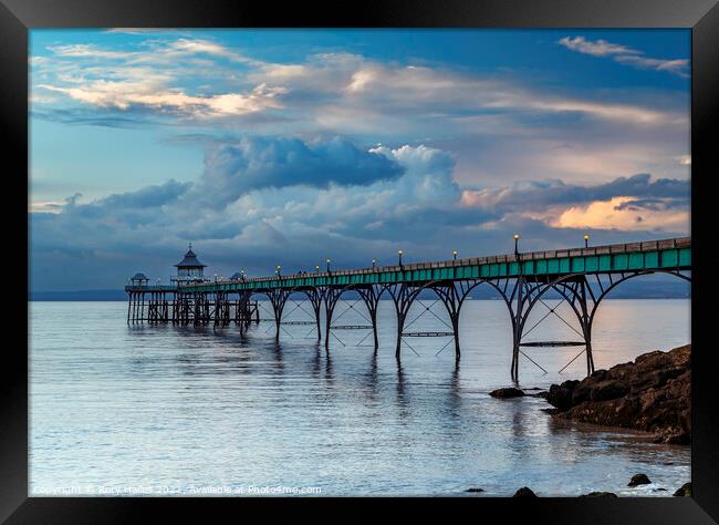 Clevedon Pier with stormy clouds Framed Print by Rory Hailes
