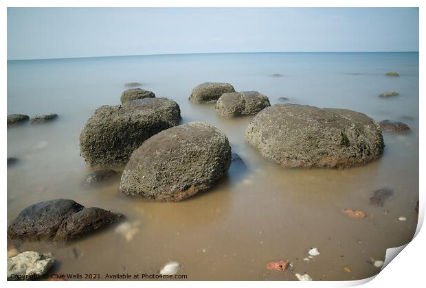 Boulders on smooth sea Print by Clive Wells
