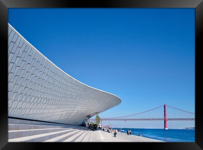 Famous MAAT Museum in Lisbon near river Tagus and Landmark 25 of April bridge Framed Print by Elijah Lovkoff