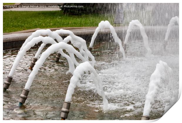 Foamed, dense jets of water burst from metal nozzles in the city fountain. Print by Sergii Petruk