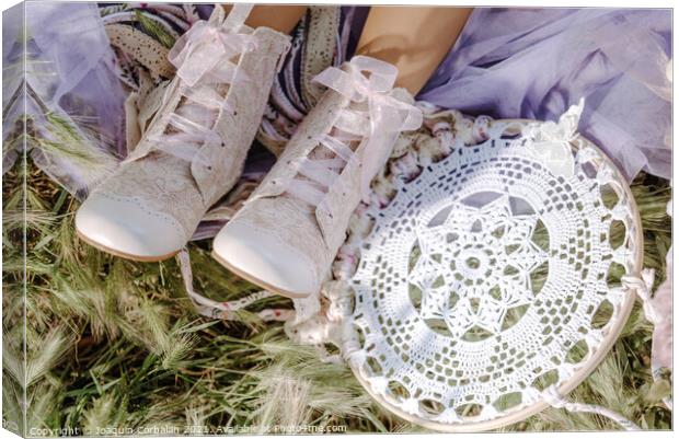Boots on the feet of a girl who rests in the fresh grass next to Canvas Print by Joaquin Corbalan