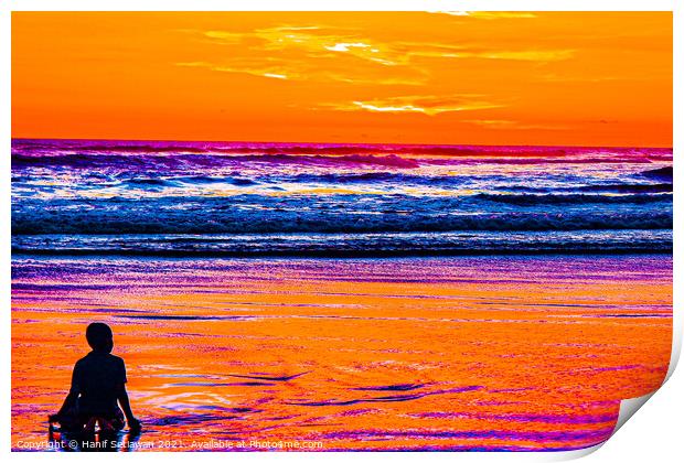 A young boy enjoys the sunset at a sand beach. Print by Hanif Setiawan