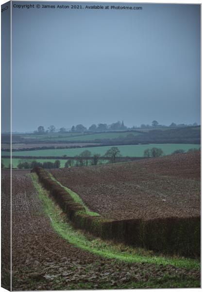 Misty Damp View of Rutland Canvas Print by James Aston