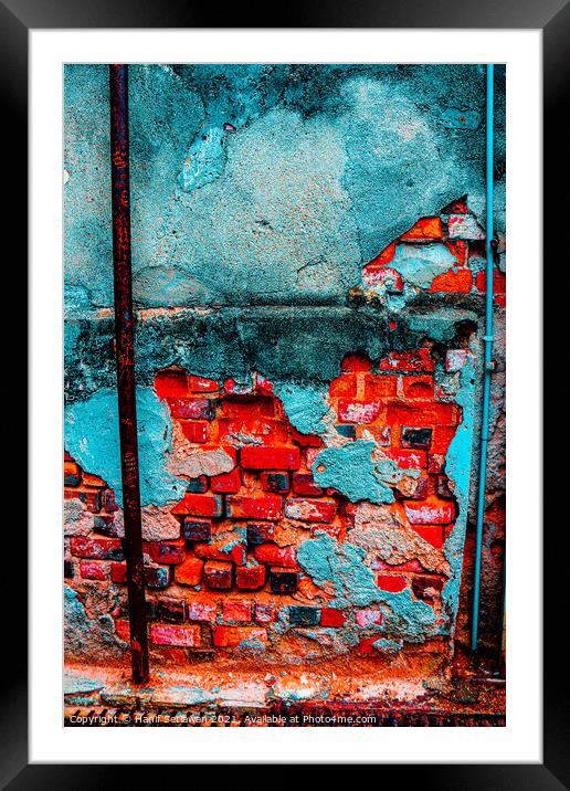 A damaged brick wall in digital red turquoise blue Framed Mounted Print by Hanif Setiawan