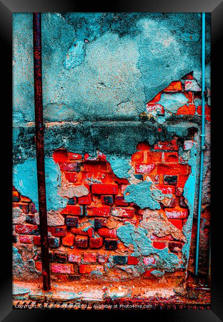 A damaged brick wall in digital red turquoise blue Framed Print by Hanif Setiawan