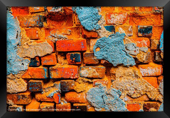 A damaged brick wall in digital brown turquoise bl Framed Print by Hanif Setiawan