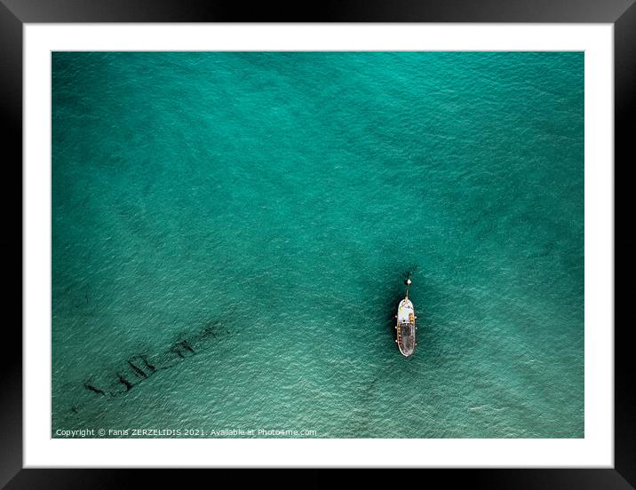 A lonely boat Framed Mounted Print by Fanis Zerzelides