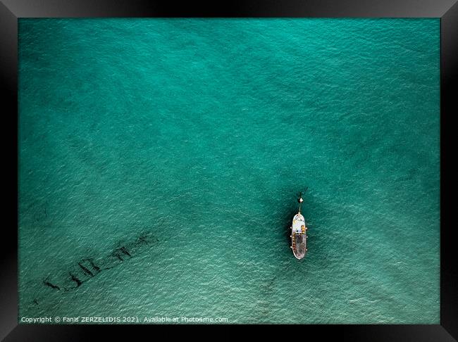 A lonely boat Framed Print by Fanis Zerzelides