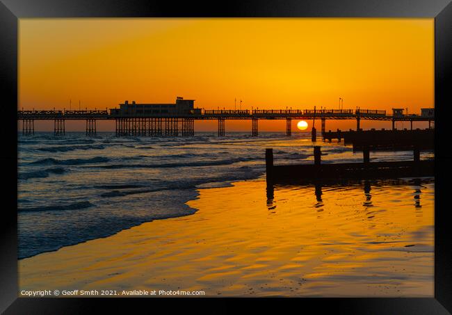 Sun setting at Worthing Pier Framed Print by Geoff Smith