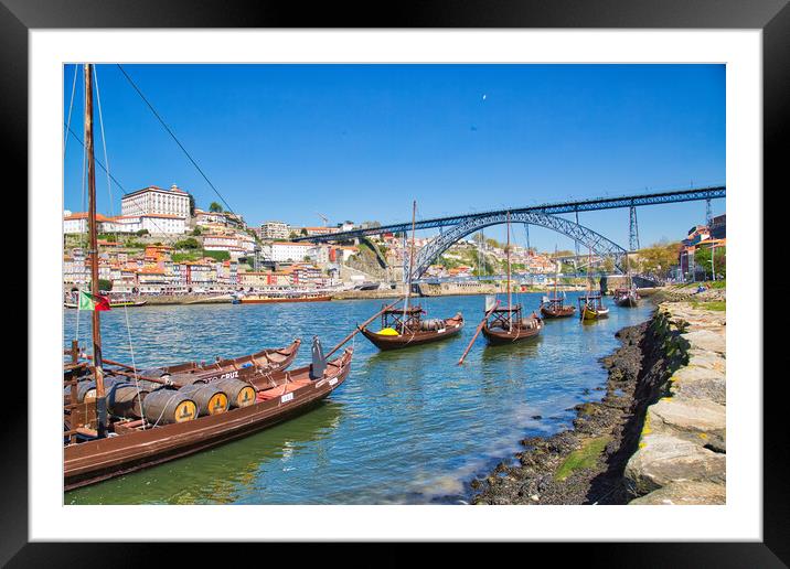 Famousboats providing carrying Porto wine in barrels on Rio Douro Framed Mounted Print by Elijah Lovkoff
