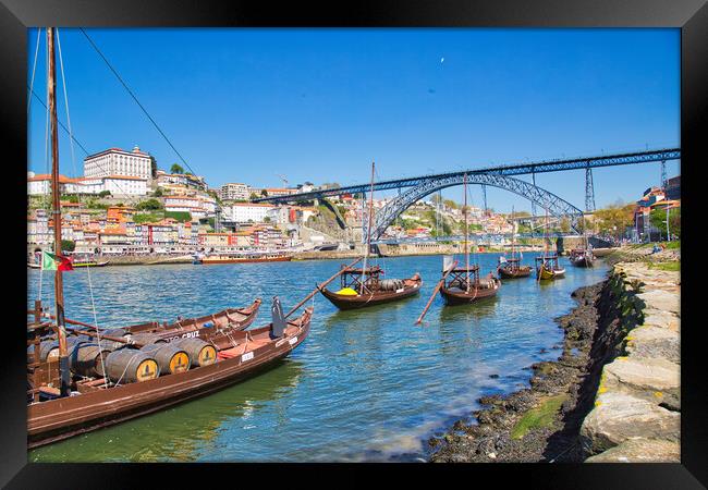 Famousboats providing carrying Porto wine in barrels on Rio Douro Framed Print by Elijah Lovkoff
