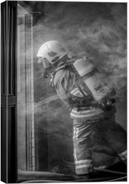 Firefighter Working in Smoke Canvas Print by Roger Green