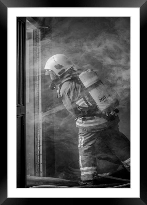 Firefighter Working in Smoke Framed Mounted Print by Roger Green