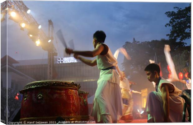 Young drummer performer on a culture festival Canvas Print by Hanif Setiawan
