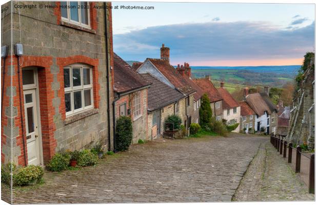 Pretty cottages on a cobbled street Canvas Print by Helen Hotson