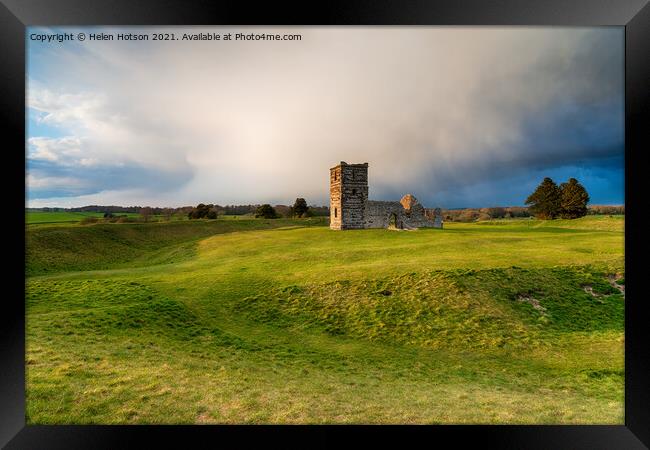 Dramatic skies over the old church at Knowlton  Framed Print by Helen Hotson