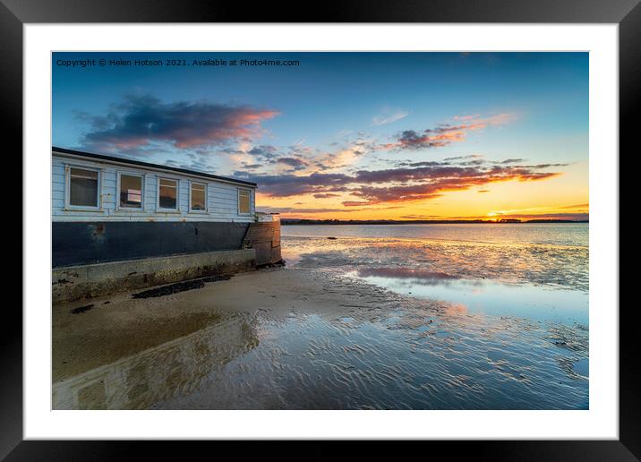 Sunset over an old boat on Bramble Bush Bay at Studland in Poole Framed Mounted Print by Helen Hotson