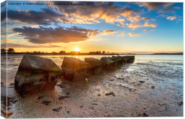 Beautiful sunset over old WWII tank traps in Bramble Bush Bay  Canvas Print by Helen Hotson