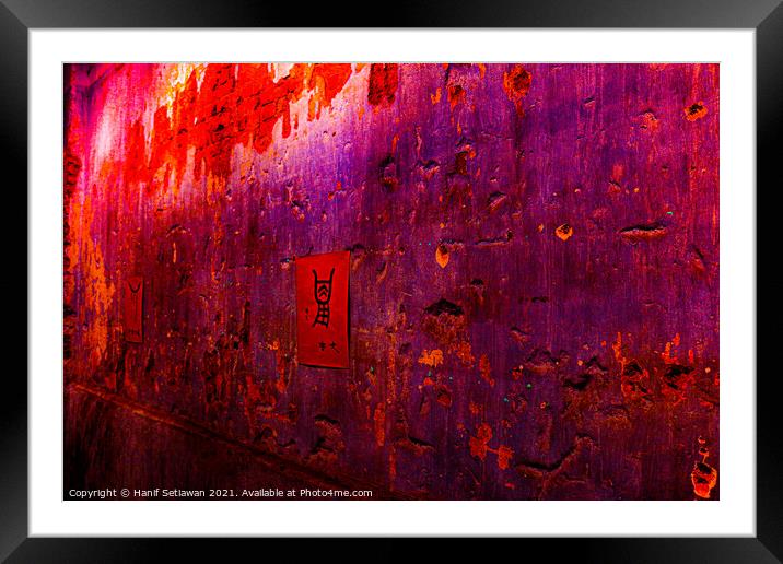 Small red poster with Chinese script on a violet wall. Framed Mounted Print by Hanif Setiawan