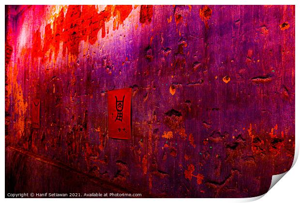 Small red poster with Chinese script on a violet wall. Print by Hanif Setiawan