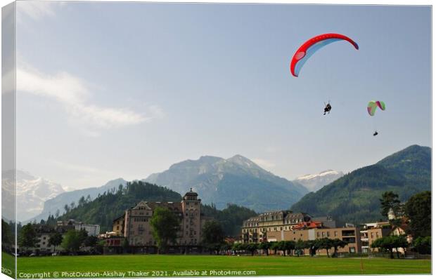 A group of people enjoying paragliding  Canvas Print by PhotOvation-Akshay Thaker