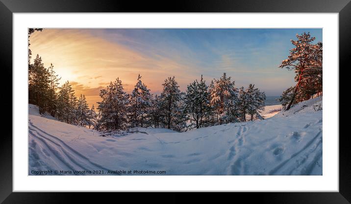 Sunset over frozen snowy forest Framed Mounted Print by Maria Vonotna