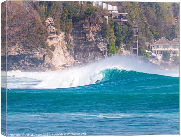 Surfer riding that pipe Canvas Print by James Aston