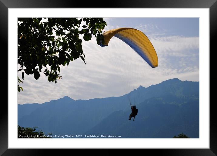 A person flying through the air on top of a mounta Framed Mounted Print by PhotOvation-Akshay Thaker