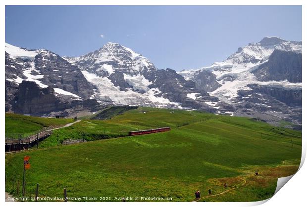 Famous electric red tourist train with mountains in the background Print by PhotOvation-Akshay Thaker