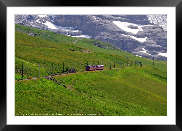 The famous tourist train grazing on a lush green hillside Framed Mounted Print by PhotOvation-Akshay Thaker