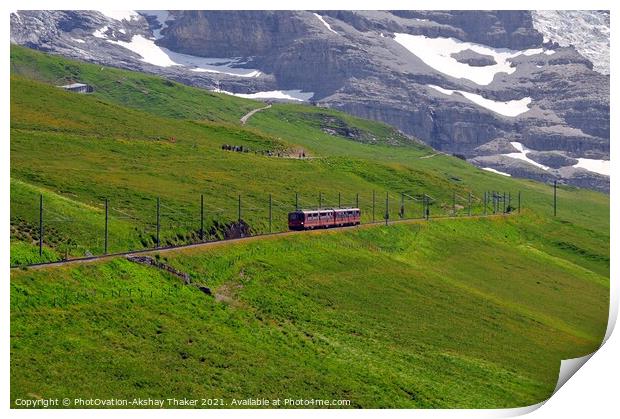 The famous tourist train grazing on a lush green hillside Print by PhotOvation-Akshay Thaker