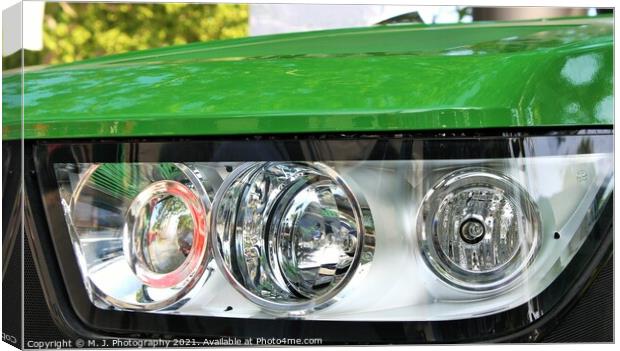 headlight on the front  of John Deere tractor Canvas Print by M. J. Photography