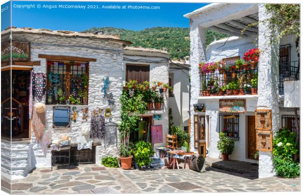 Souvenir shops in Pampaneira in Andalusia, Spain Canvas Print by Angus McComiskey