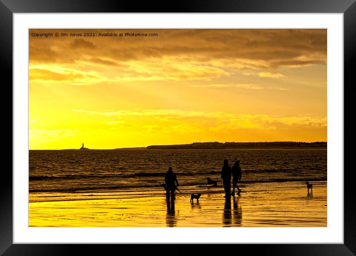 Dog walkers on the beach at sunrise Framed Mounted Print by Jim Jones