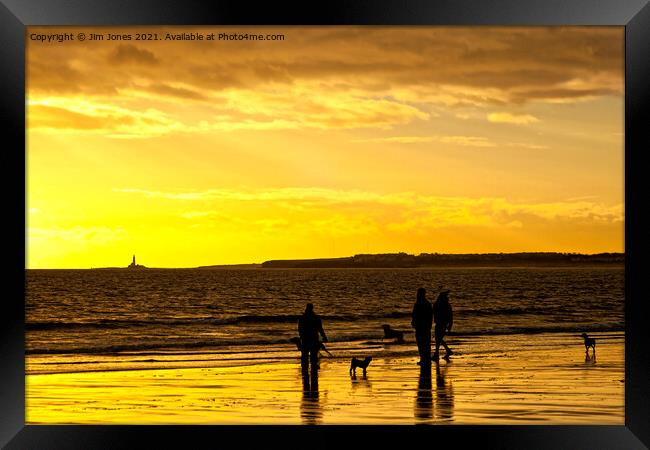 Dog walkers on the beach at sunrise Framed Print by Jim Jones