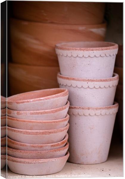 Pile Of Terracotta Flower Pots On A Shelf Canvas Print by Peter Greenway
