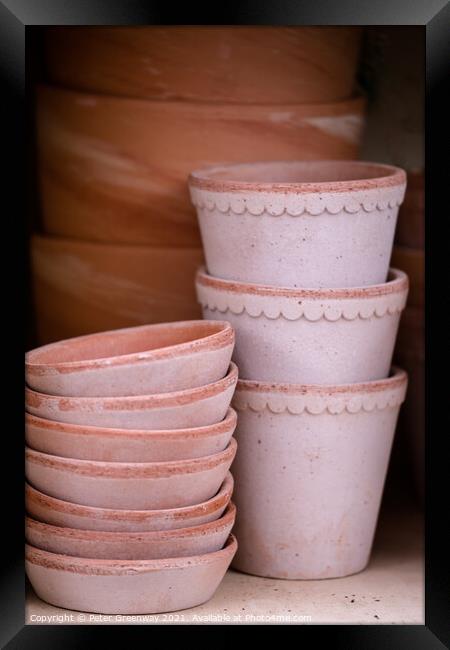 Pile Of Terracotta Flower Pots On A Shelf Framed Print by Peter Greenway
