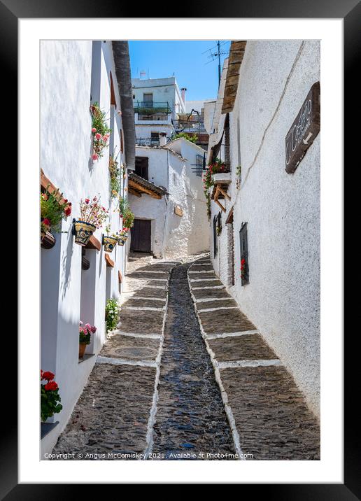 Narrow alleyway in Pampaneira, Andalusia, Spain Framed Mounted Print by Angus McComiskey