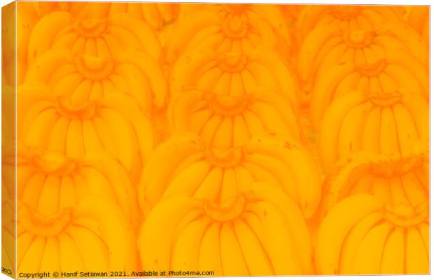 Banana bunches in symmetric order and bright yello Canvas Print by Hanif Setiawan