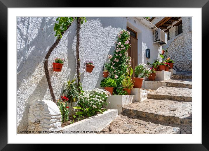 Colourful alleyway in Pampaneira, Andalusia, Spain Framed Mounted Print by Angus McComiskey
