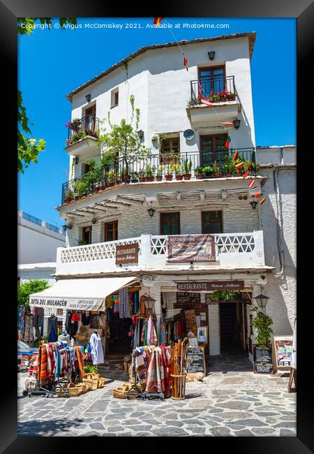 Apartment block and shop in Pampaneira, Spain Framed Print by Angus McComiskey