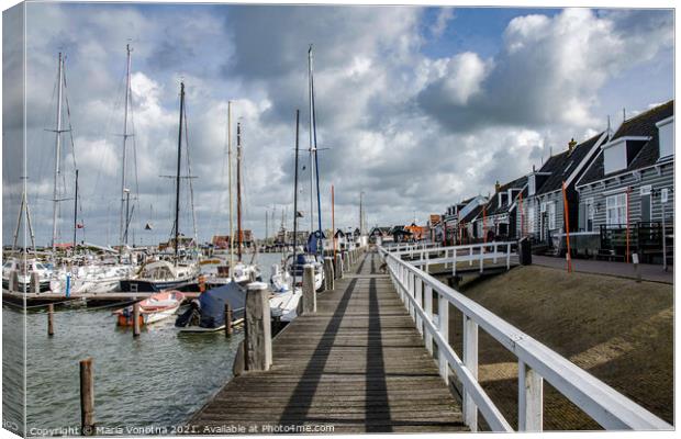 Pier with boats in Marken Canvas Print by Maria Vonotna