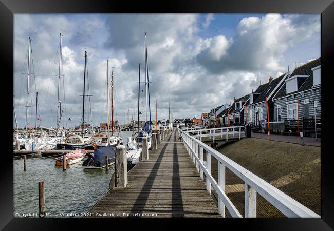 Pier with boats in Marken Framed Print by Maria Vonotna