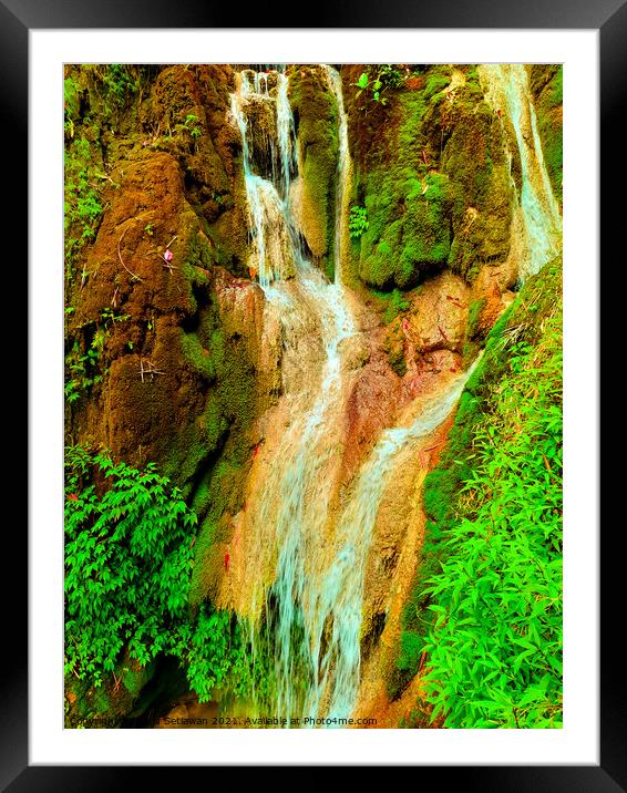 A waterfall flowing over rocks at Mudal river. Framed Mounted Print by Hanif Setiawan