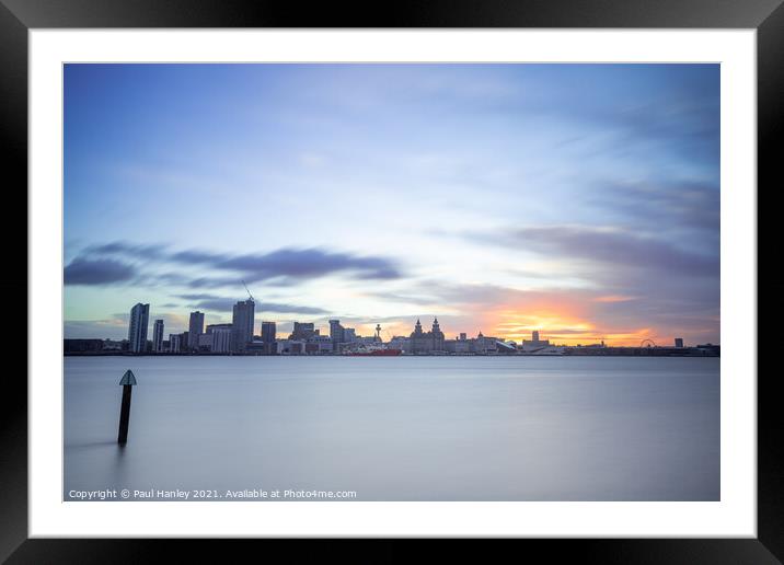 The sun rising over the skyline of Liverpool Framed Mounted Print by Paul Hanley